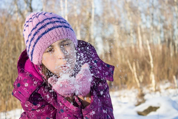 Small girl blow snow — Stock Photo, Image