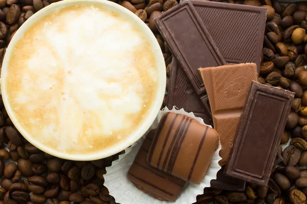 Chocolate on cofee background — Stock Photo, Image