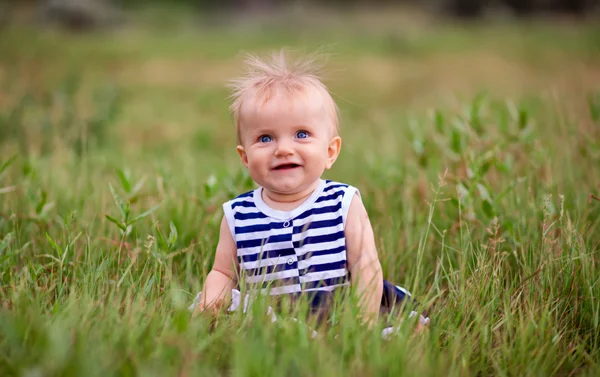 Cute little girl on the meadow in spring day — Stock Photo, Image