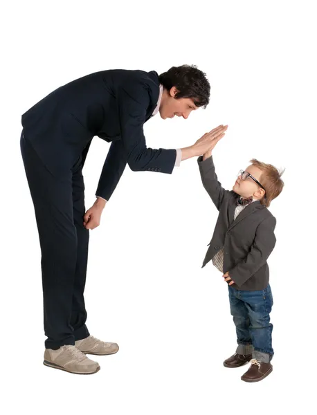 Man and little boy shake hands isolated on the white — Stock Photo, Image