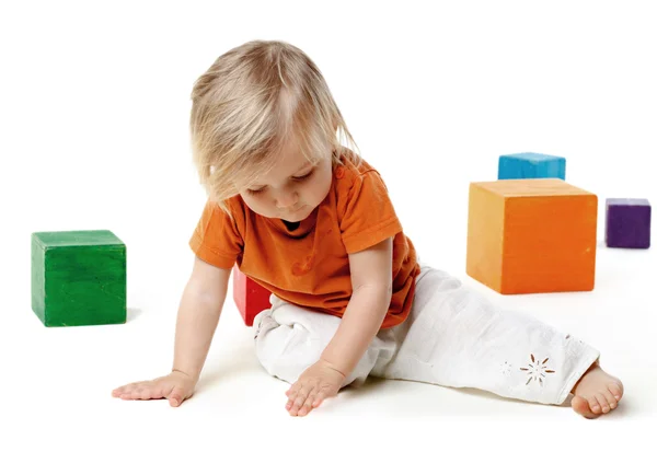 Little girl playing with cubes — Stock Photo, Image