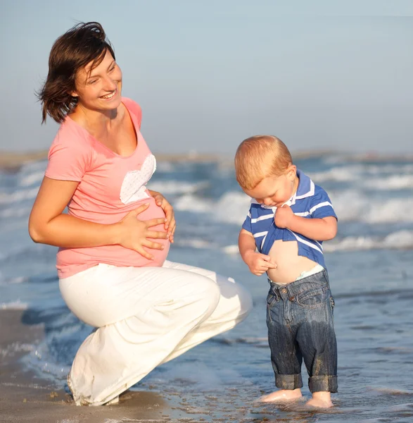 Pregnant mother and little son — Stock Photo, Image
