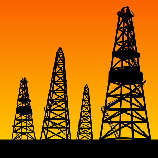 Oil rig silhouettes and orange sky