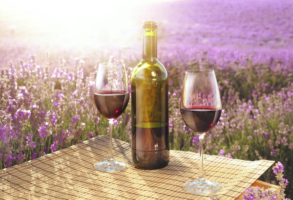 Red wine bottle and glass. — Stock Photo, Image