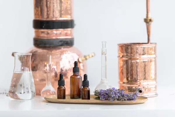 Distillation of lavender essential oil. Copper alambic in a Scandinavian interior