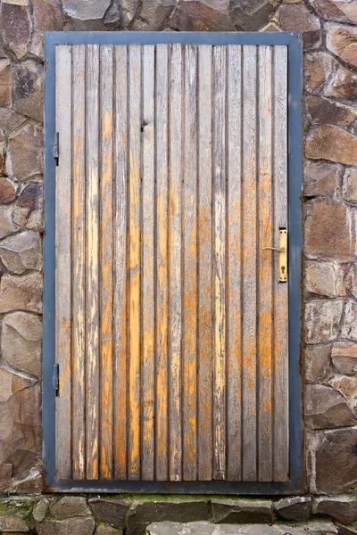 Old wooden door in a frame and a box — Stock Photo, Image