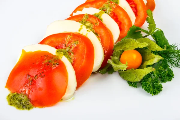 Tomatoes and cheese — Stock Photo, Image