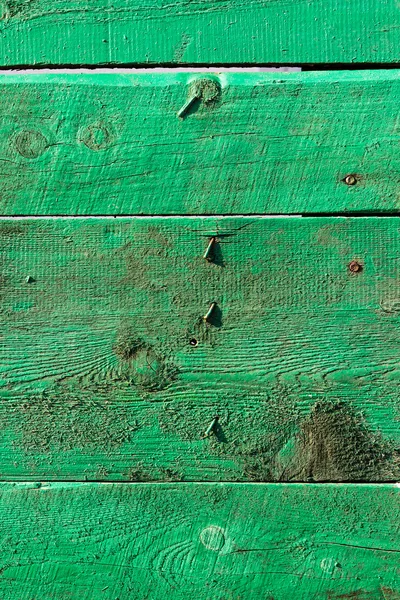 Green wooden boards with nails — Stock Photo, Image