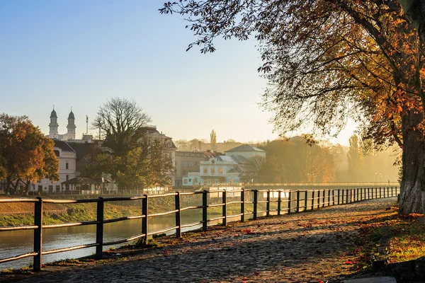 Autumn morning on old town embankment filled with light — Stock Photo, Image