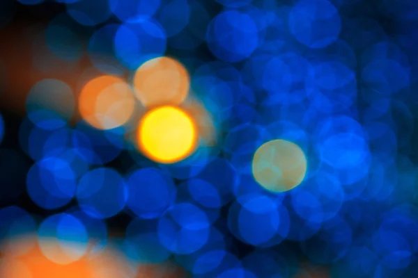 Gele bokeh licht op blauwe achtergrond — Stockfoto