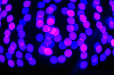 Bokeh efektli bulanık ışıkların soyut arkaplanı