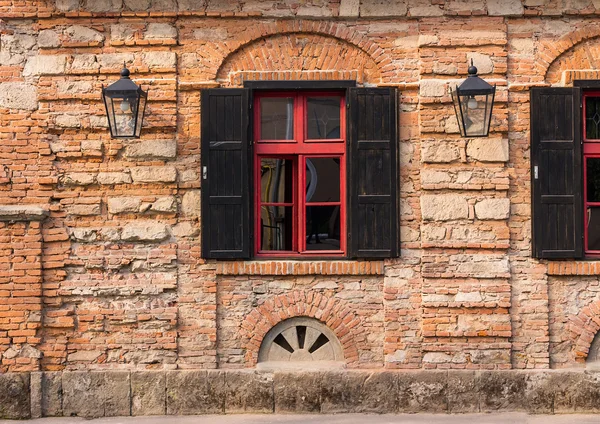 Old window frame on the wall with lantern — Stock Photo, Image