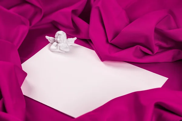 Love card with angel on a purple fabric — Stock Photo, Image