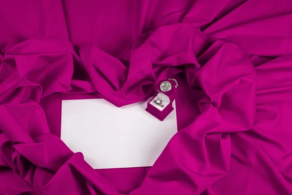 Love card with diamond ring on a purple fabric — Stock Photo, Image