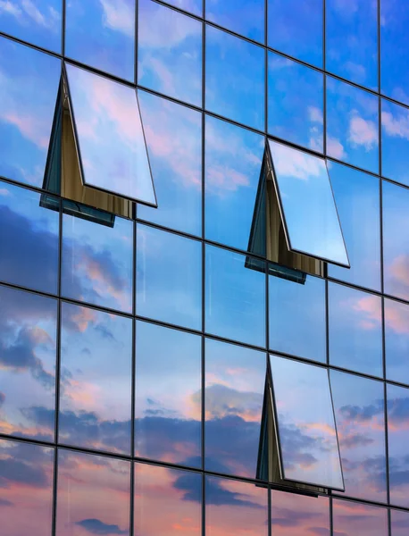 Reflection in open windows  of  skyscraper at sunset — Stock Photo, Image