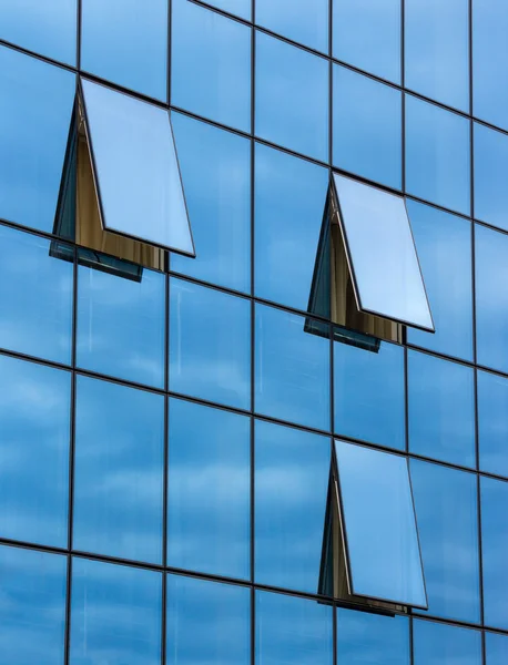 Reflection in open windows  of  skyscraper — Stock Photo, Image