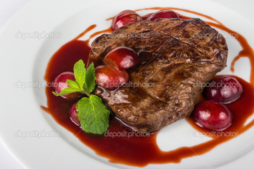 grilled beef steak with plums
