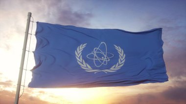 Uluslararası Atom Enerjisi Ajansı IAEA 'nın bayrağı rüzgarda, havada ve güneşte sallanıyor. 3d oluşturma.