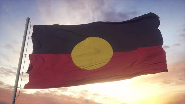 Australia Aboriginal flag waving in the wind, sky and sun background. 3d rendering.