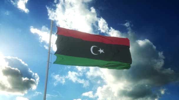 Σημαία της Λιβύης κυματίζει στον άνεμο ενάντια στον όμορφο γαλάζιο ουρανό — Αρχείο Βίντεο