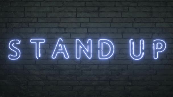 Cartel de neón Stand Up sobre fondo de pared de ladrillo negro — Vídeos de Stock