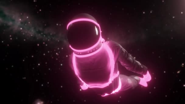 우주비행사는 반짝이는 네온 조명에 둘러쌓여 있습니다. 어두운 우주에서 네온등을 켜고 있는 우주비행사 — 비디오