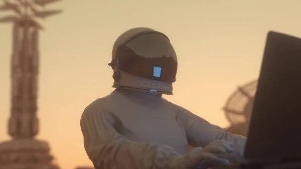 火星の植民地概念 宇宙飛行士は 惑星の一つの宇宙植民地で彼の科学ラップトップで働いています 3Dレンダリング — ストック写真