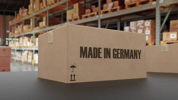 コンベア上のドイツ語のテキストで作られたボックス 3Dレンダリング — ストック写真
