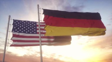 Bayrak direğinde Almanya ve ABD bayrağı. Almanya ve ABD rüzgarda bayrak sallıyor. Almanya ve ABD diplomatik konsepti