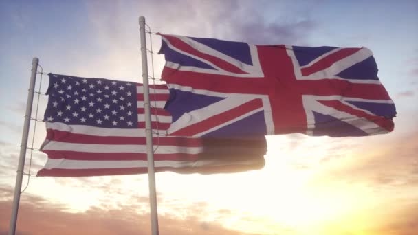 Vlajka USA a Spojeného království na vlajkovém stožáru. USA a Velká Británie mávají vlajkou ve větru. USA a Spojené království Velké Británie diplomatický koncept — Stock video