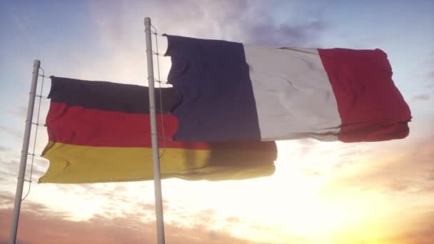 德国和法国在旗杆上悬挂国旗.德国和法国在风中飘扬国旗.德国和法国的外交概念 — 图库视频影像