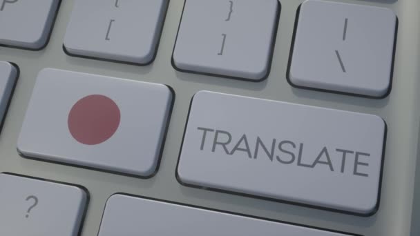 Перевести концепцию на клавиатуру с флагом Японии. Кнопка флага Японии на клавиатуре — стоковое видео