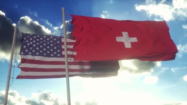スイスとアメリカは旗竿に旗を掲げた スイスと米国の外交概念 青空の背景 — ストック動画