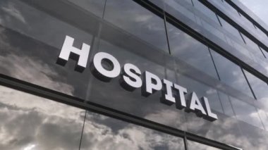 Modern cam gökdelenin üzerindeki hastane tabelası. Hastanenin cam binası. Sağlık, klinik, acil durum, sağlık ve tıbbi konsept.