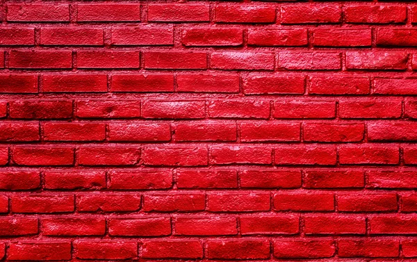 Pulserande glänsande röd tegelvägg — Stockfoto