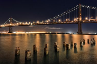 San Francisco Bay Bridge at Night Panorama clipart