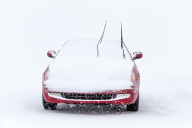 Parked Car in Winter Snowstorm clipart