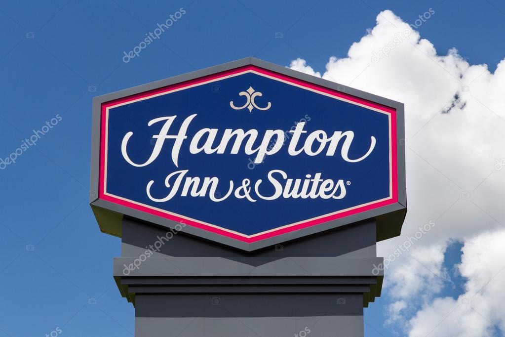 Hampton Inn and Suites sign. Hampton Inn and Suites is a brand of independently owned hotels trademarked by Hilton Worldwide.