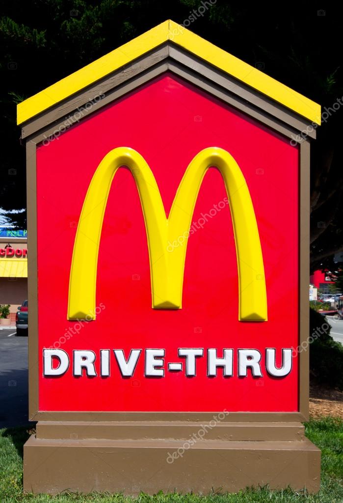 McDonald's Drive-Thru sign. The McDonald's Corporation is the world's largest chain of hamburger fast food restaurants.