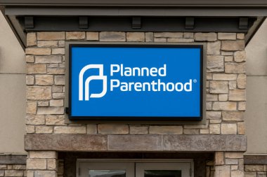 MINNEAPOLIS, MN, USA - JUNE 12, 2022: Planned Parenthood clinic exterior and trademark logo. clipart