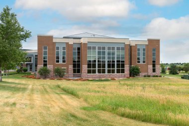 SIOUX FALLS, SD, USA - JULY 11, 2022: Campus walkway and Avera Hall at University of South Dakota Sioux Falls.