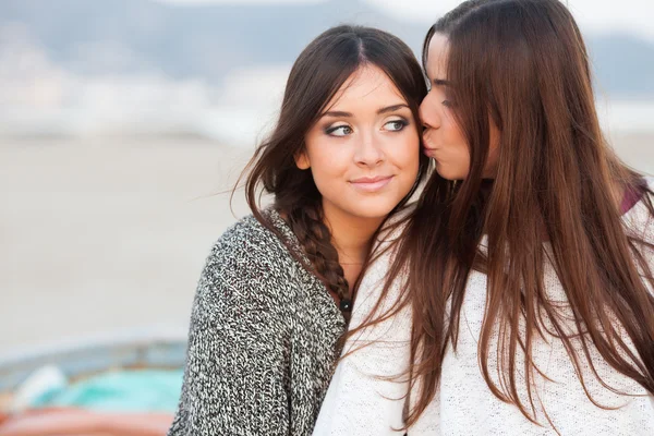 Young beautiful girlfriends portrait kiss — Stock Photo, Image