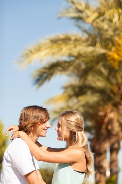 Young romantic beautiful couple enjoying on a walkside — Stock Photo, Image