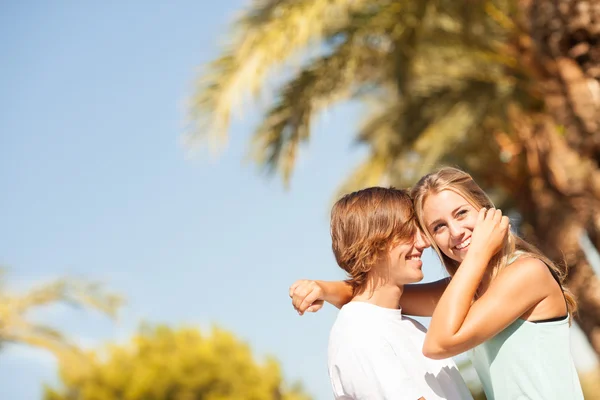 Young romantic beautiful couple enjoying on a walkside — Stock Photo, Image