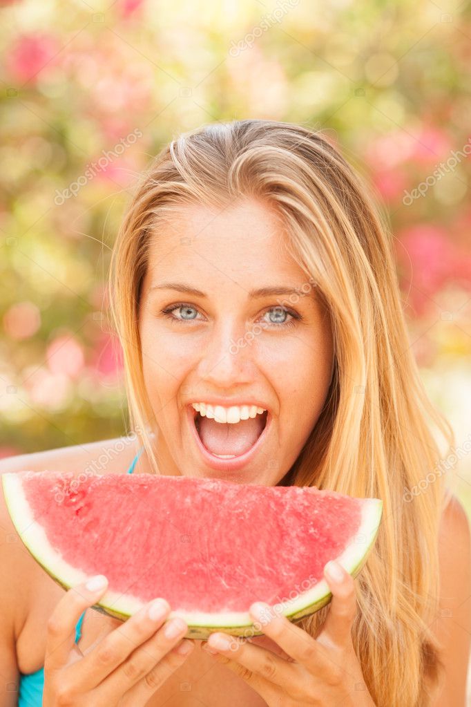Portrait of a beautiful young woman eating watermelon — Stock Photo ...