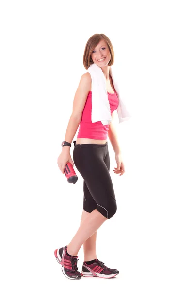 Young beautiful sport woman standing with a towel isolated on wh — Stock Photo, Image