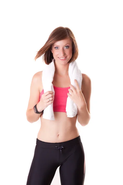 Young beautiful sport woman standing with a towel isolated on wh — Stock Photo, Image