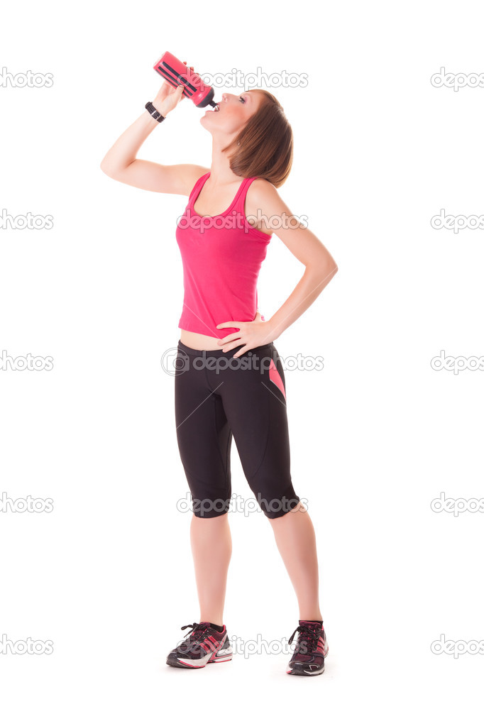 young beautiful sport woman drinking isolated on white