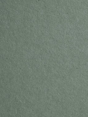 Gri mukavvanın yüzeyi. Selüloz lifli kağıt dokusu. Genel gri renkli, dikey kağıt kaplama arka plan. Dokulu, büyüleyici ve zarif bir zemin. Baştan aşağı. Makro