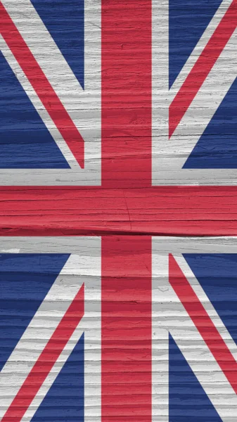 乾燥した木製の表面に英国の旗の断片 自然な縦の背景 古い木で作られた携帯電話の壁紙 イギリスの公式シンボルです 強い影を持つ太陽光照明 ストック写真